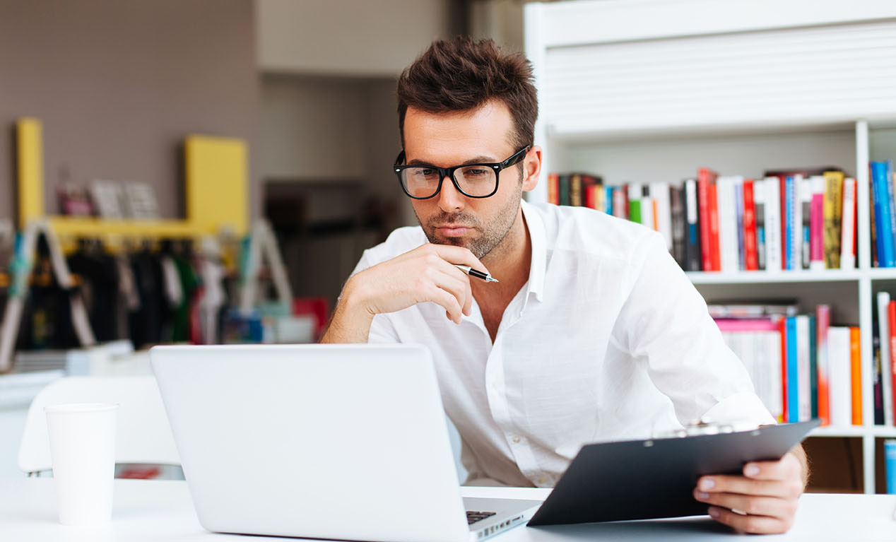 Man-staring-intently-at-computer